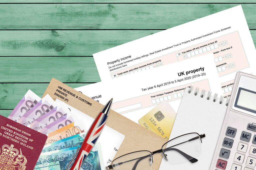 English Tax form sa105 UK Property from HM revenue and customs lies on table with office items English Tax form sa105 UK Property from HM revenue and customs lies on table with office items