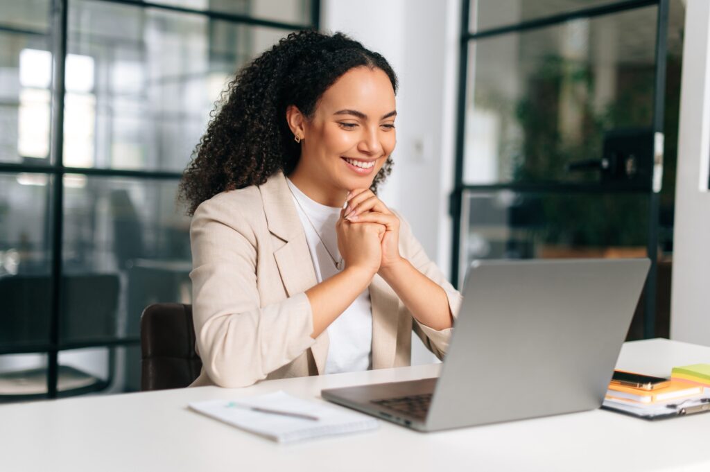 Positive brazilian or hispanic curly haired business woman, company ceo, recruitment manager Positive brazilian or hispanic curly haired business woman, company ceo, recruitment manager
